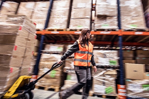 Warehouse worker pulling a pallet