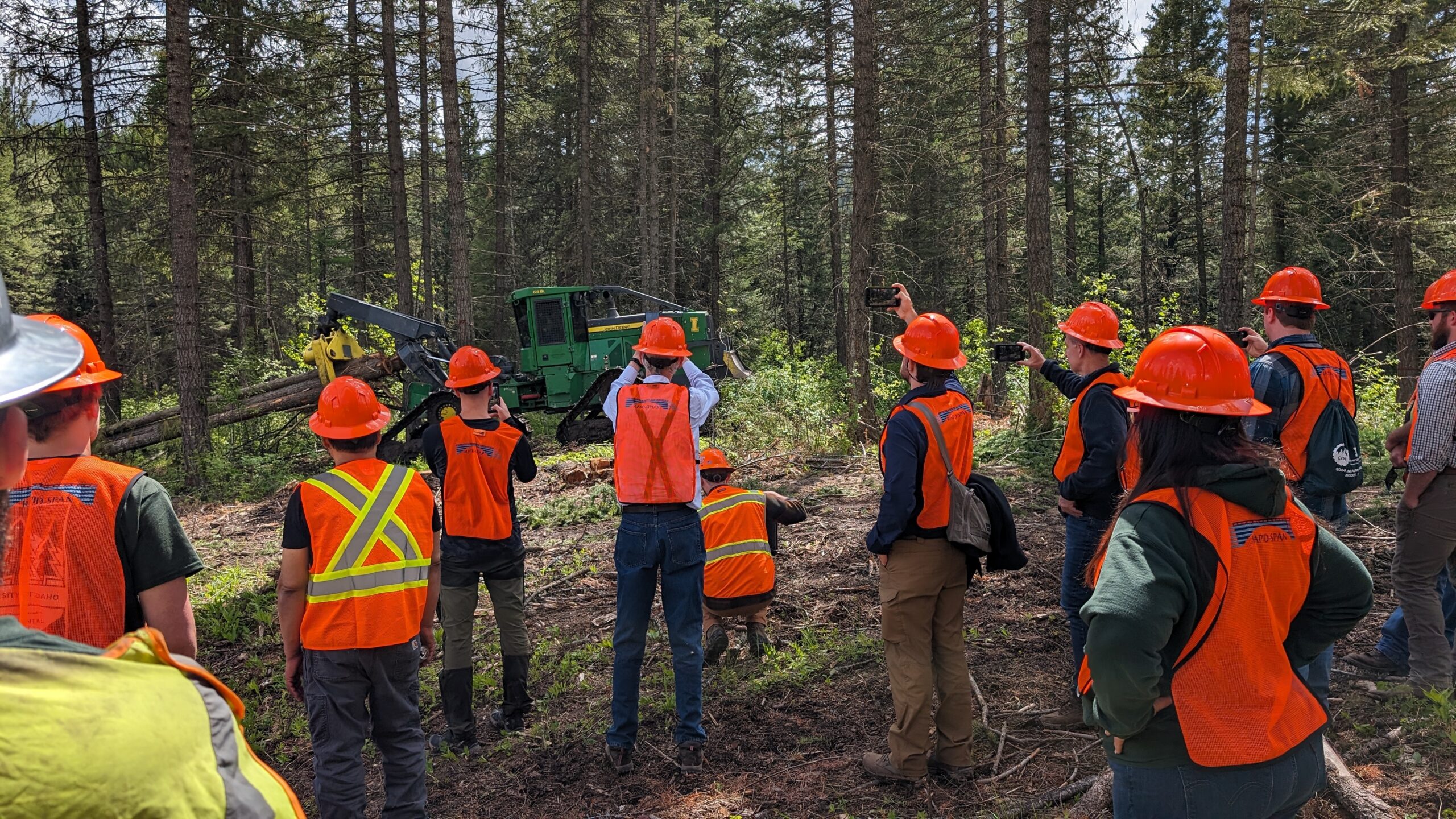 University of Idaho Student Logging Crew demonstrating a tracked log skidder with increased stability.