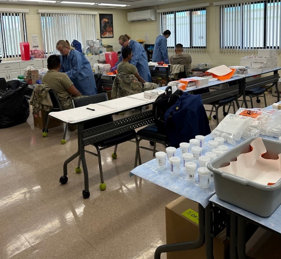 Phlebotomists drawing blood to be analyzed for inorganic elements.