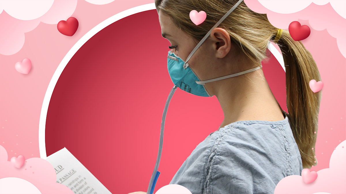 Female healthcare worker wearing a respirator.
