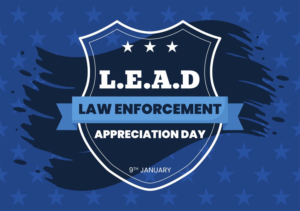Police badge that says L.E.A.D. for law enforcement awareness day. Has blue background