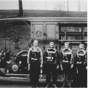 Miners wearing the first approved respirator designed to protect them from oxygen-deficient and toxic atmospheres.