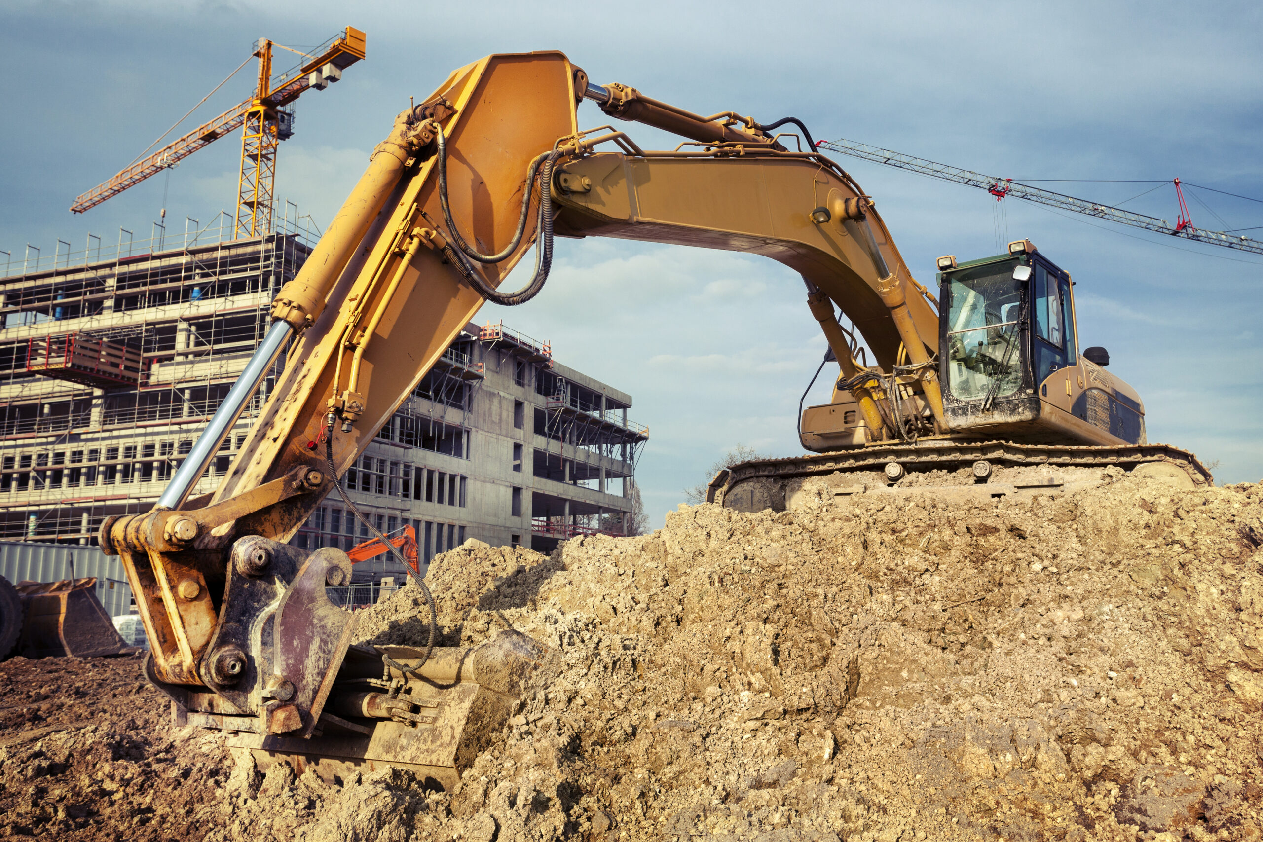 photo of a quick coupler, bucket, and excavator