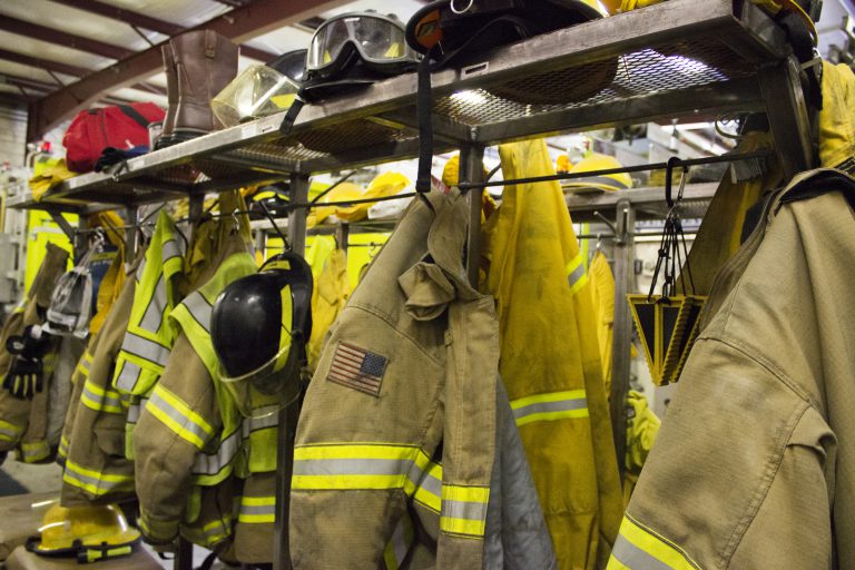 image of firefighter PPE hanging up.