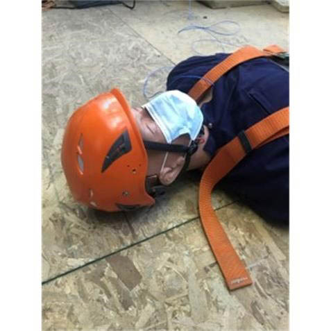 Experimental manikin with helmet.