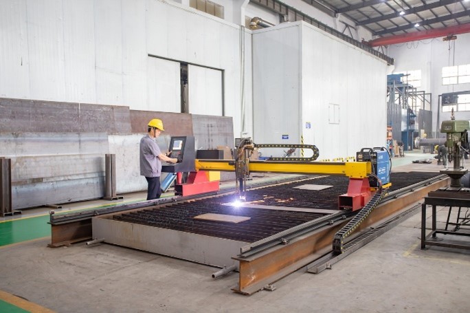 worker using a CNC machine