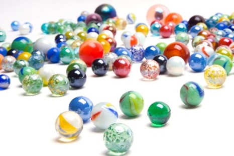 photo of several multicolored marbles