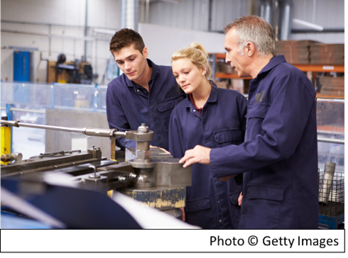 Photo of three manufacturing workers.