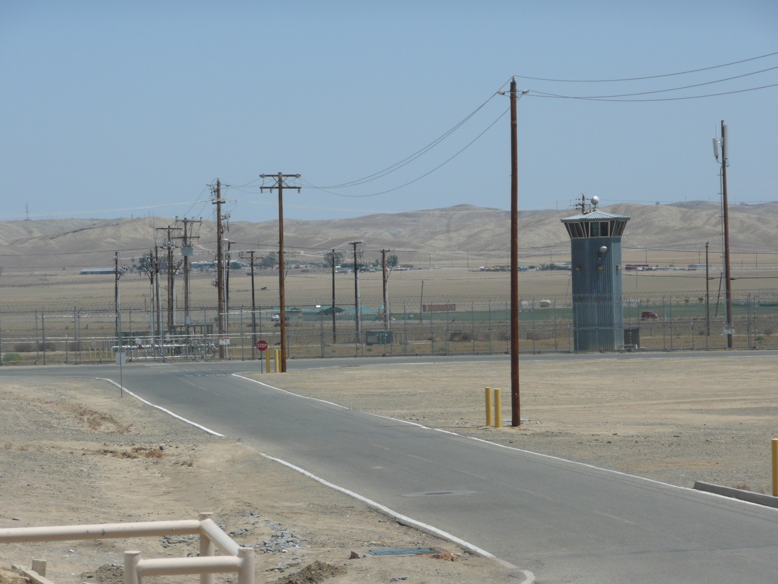 Road in desert with power lines