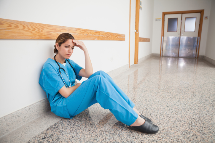 nurse sitting on the ground