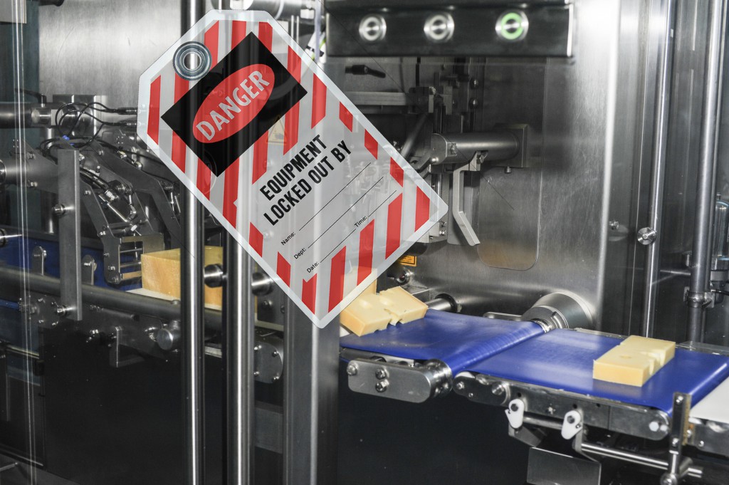 Tag on glass wall saying danger equipment locked out