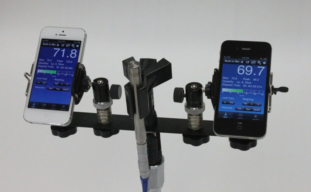 two cell phones on a mounted stand