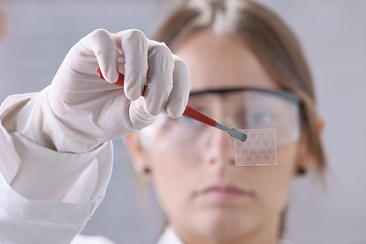 female scientist examining nanomaterials