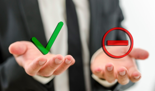 hands with a green check icon and red minus icon