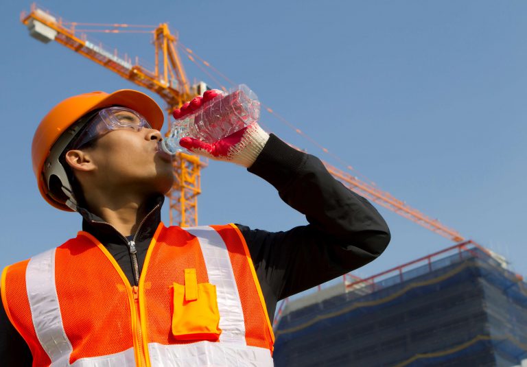 construction worker drinking water