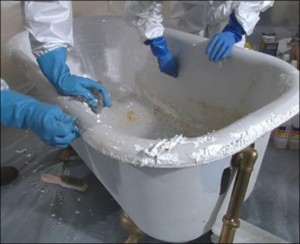 image of hands with rubber gloves refinishing a bathtub