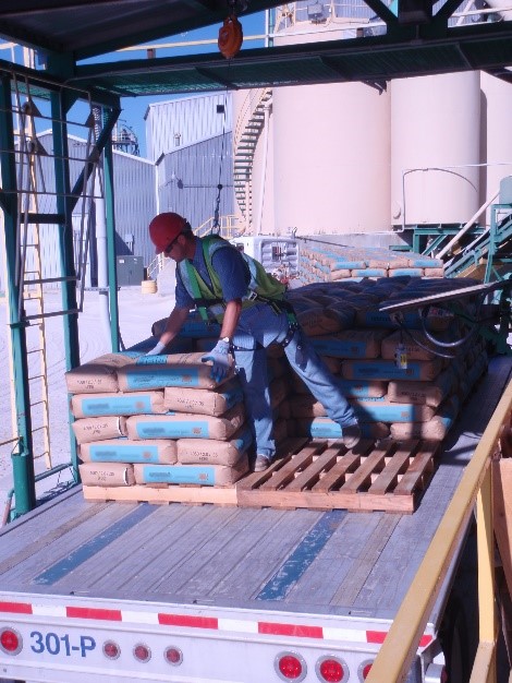 Figure 1: Surface miner places bags on pallets.