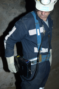 A continuous personal dust monitor at use in a mine.