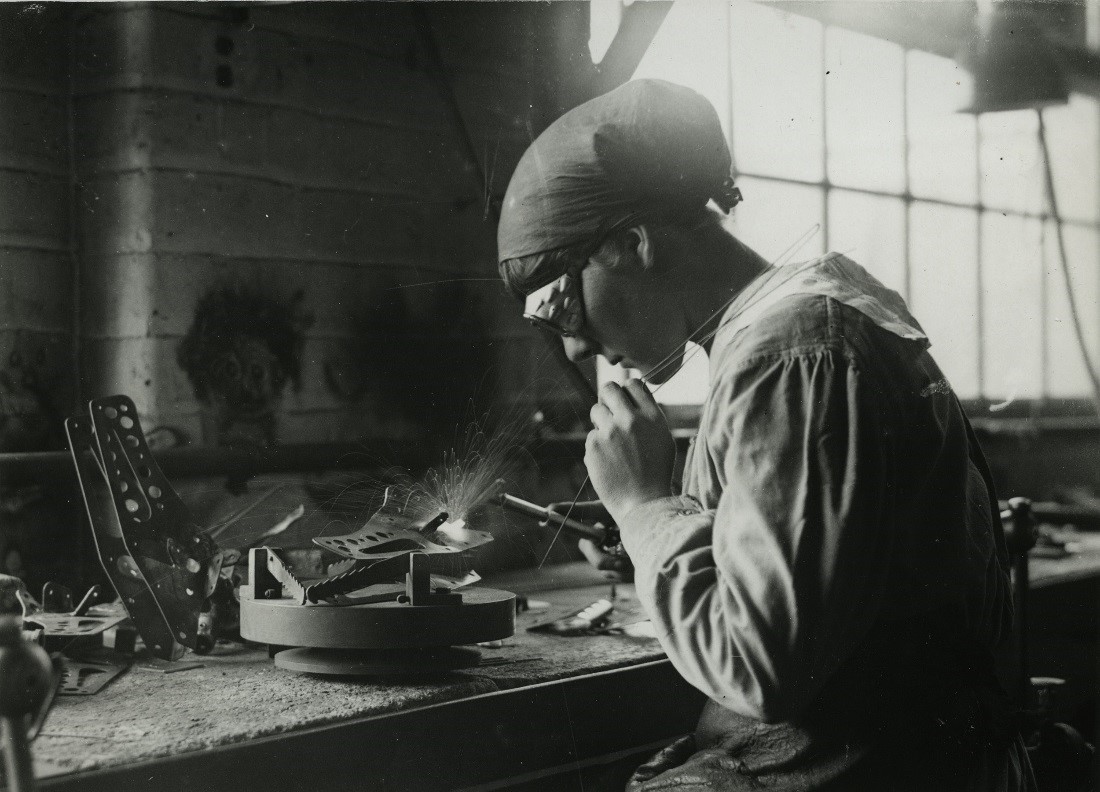photo of a woman working an industrial job in 1924