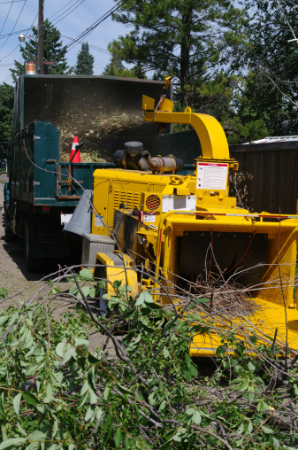 a large wood chipper and branches