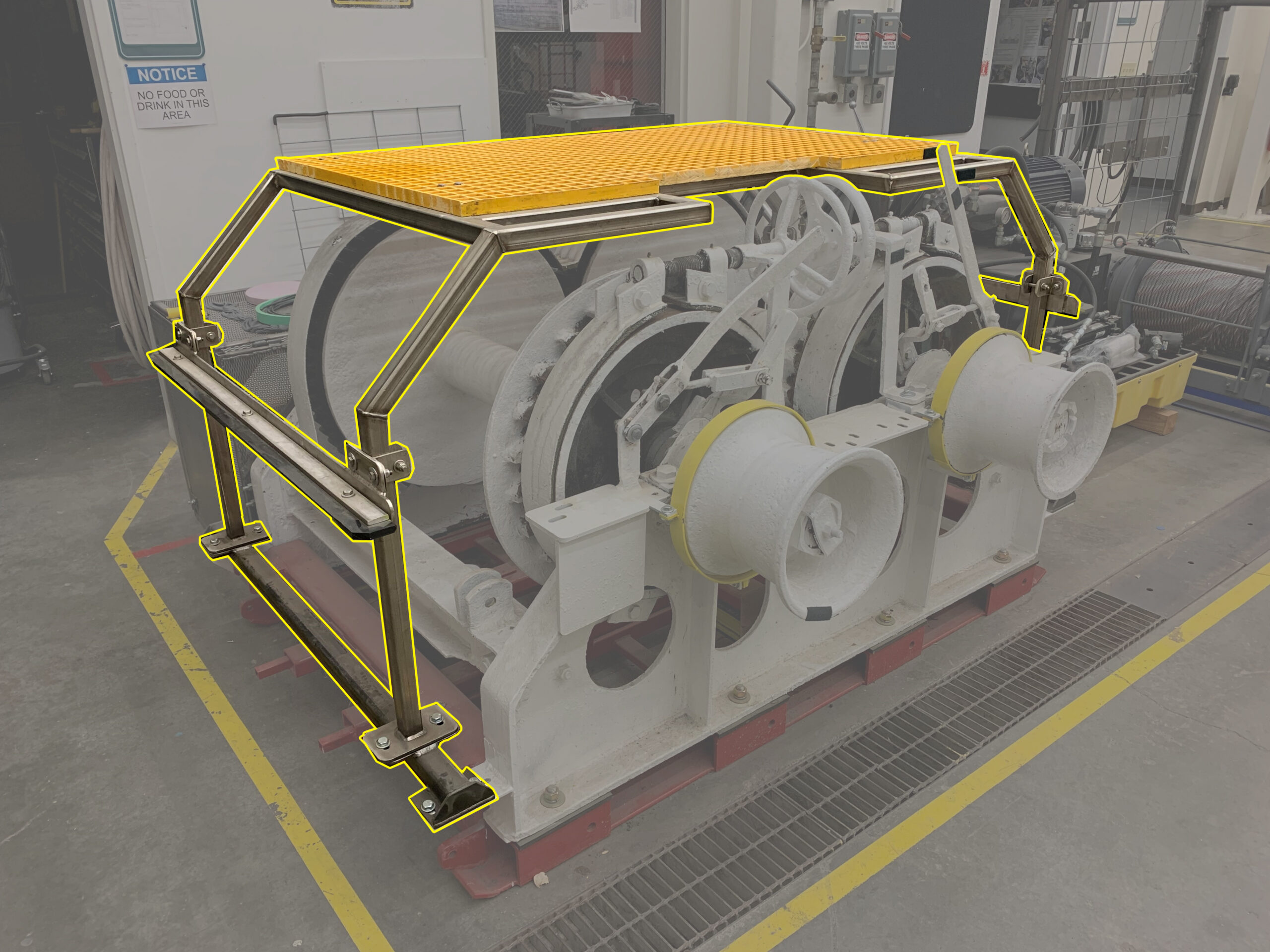 drum winch with a static guard (highlighted yellow) installed over the winch drums.