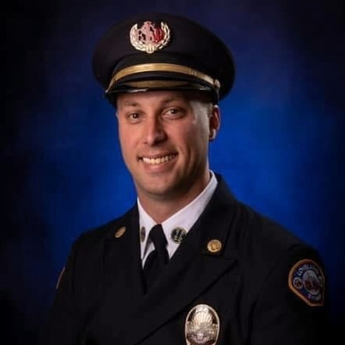 Headshot of firefighter in dress uniform