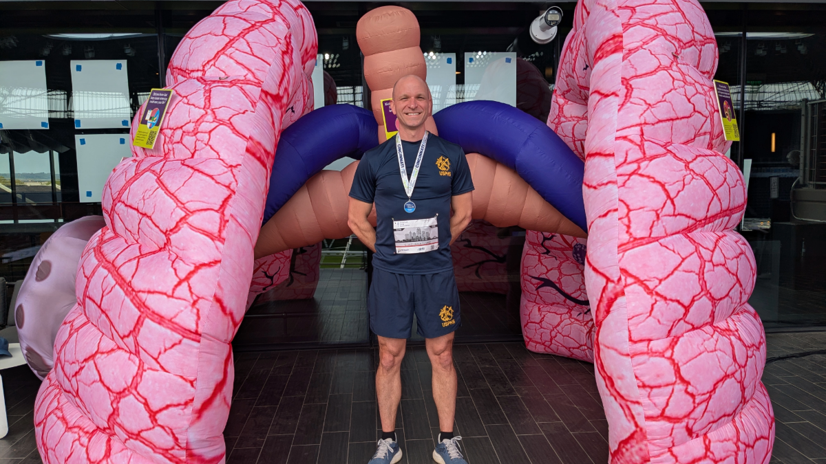Man stands in front of large, inflated lung display