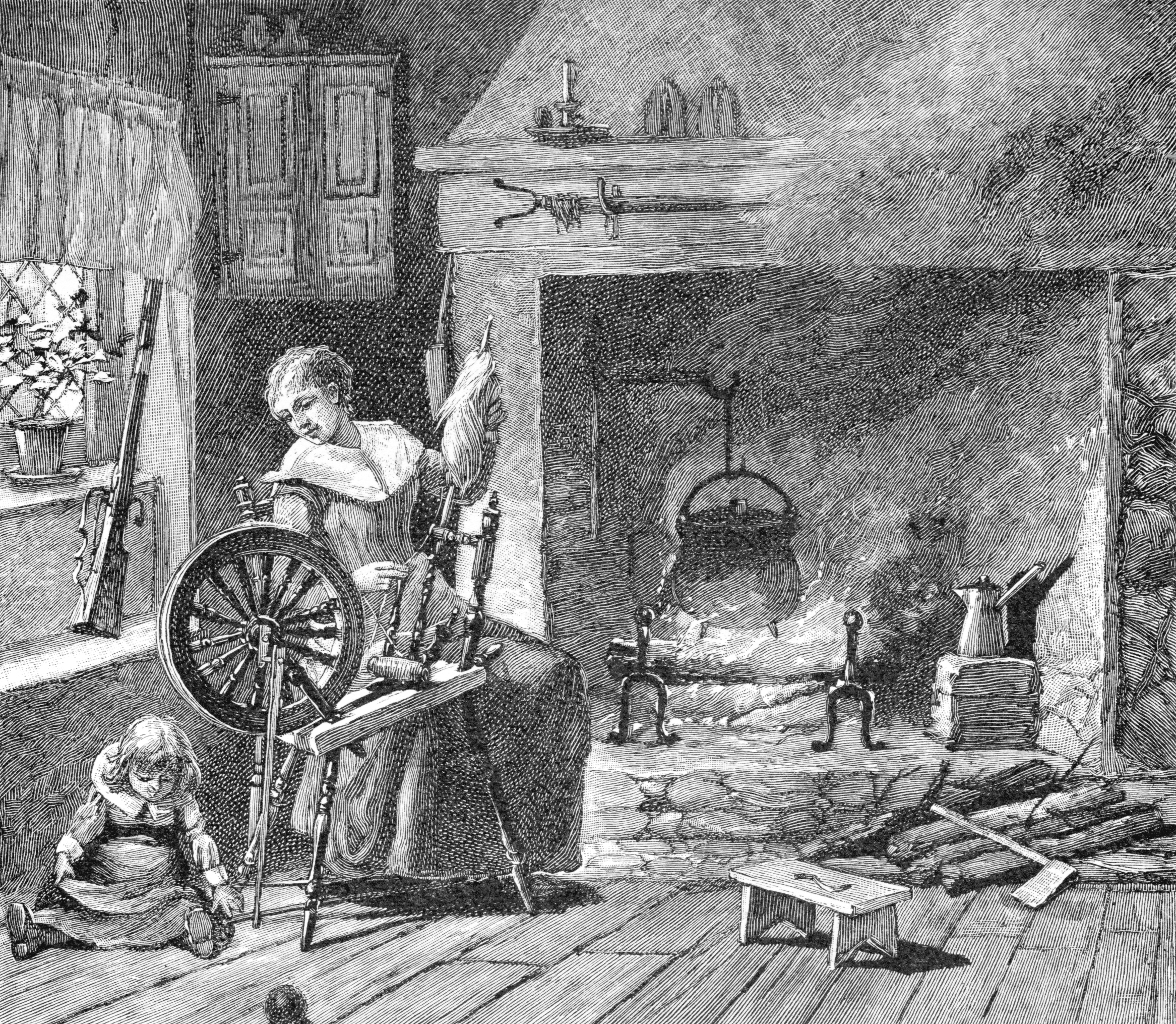 A colonial woman spinning yarn in front of a kettle over an open fire with achild on the floor.