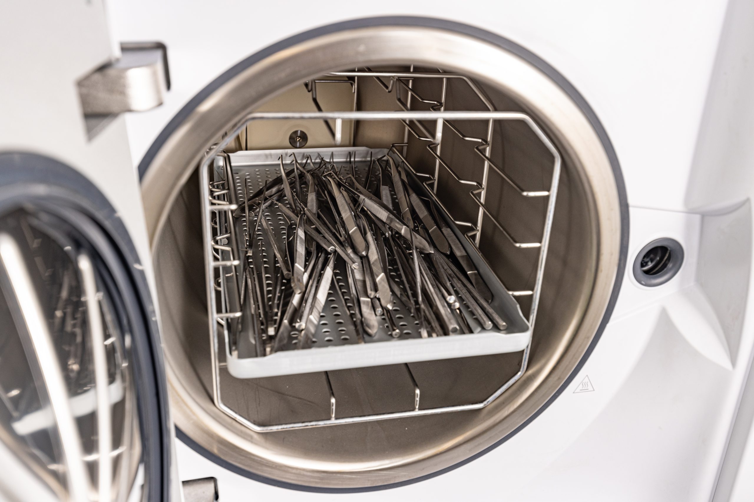 Sterilizingmedicalinstrument.jpg A cleaning machine sterilizes medical instruments.