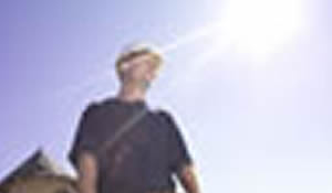 man standing outside in the sun