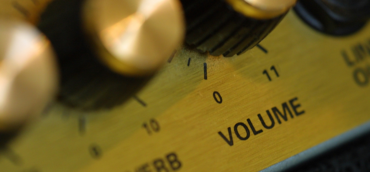 knobs on an amplifier, including a volume dail marked "11"