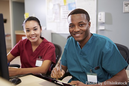 M12F A male and female nurse smiling