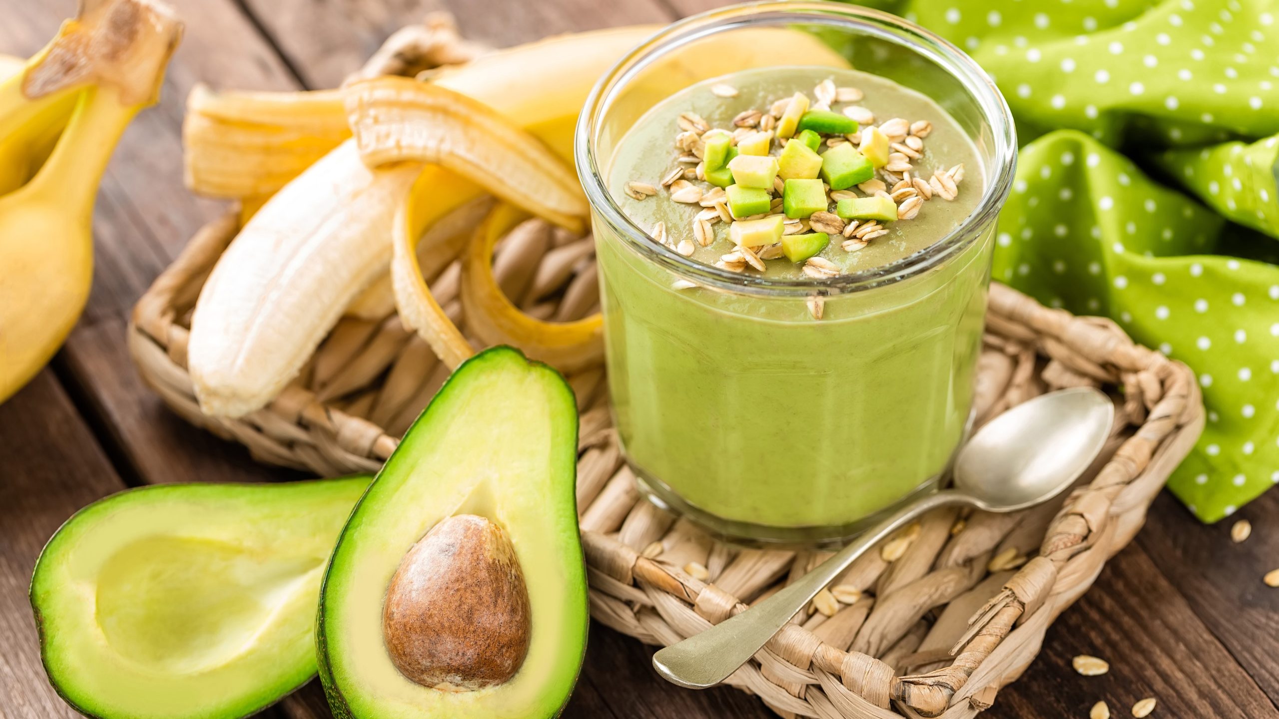 Unsaturated Fat Avocado Banana A photo of a smoothie bowl accompanied with sliced avocado and banana.