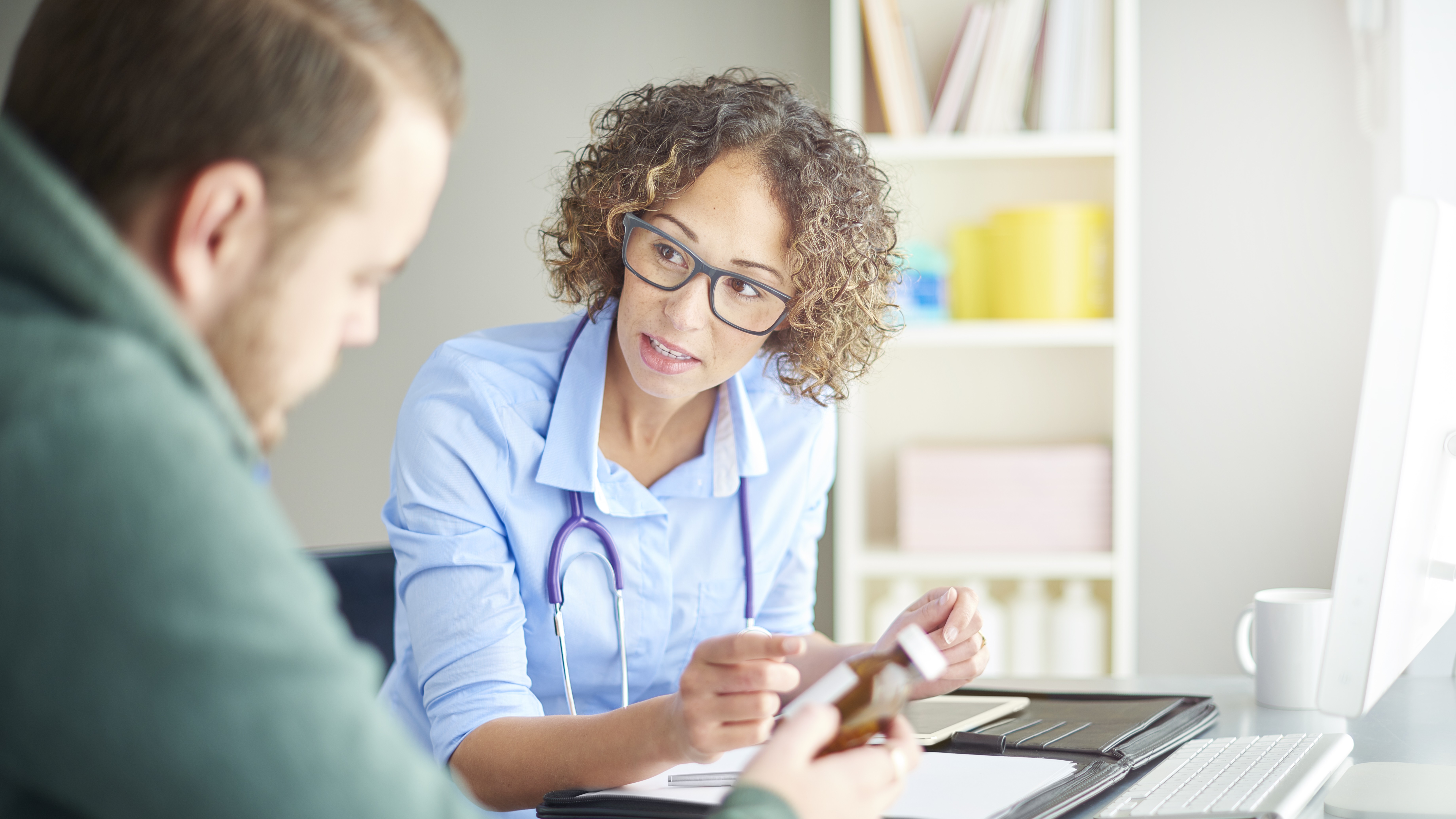 Patient speaking with their health care provider.
