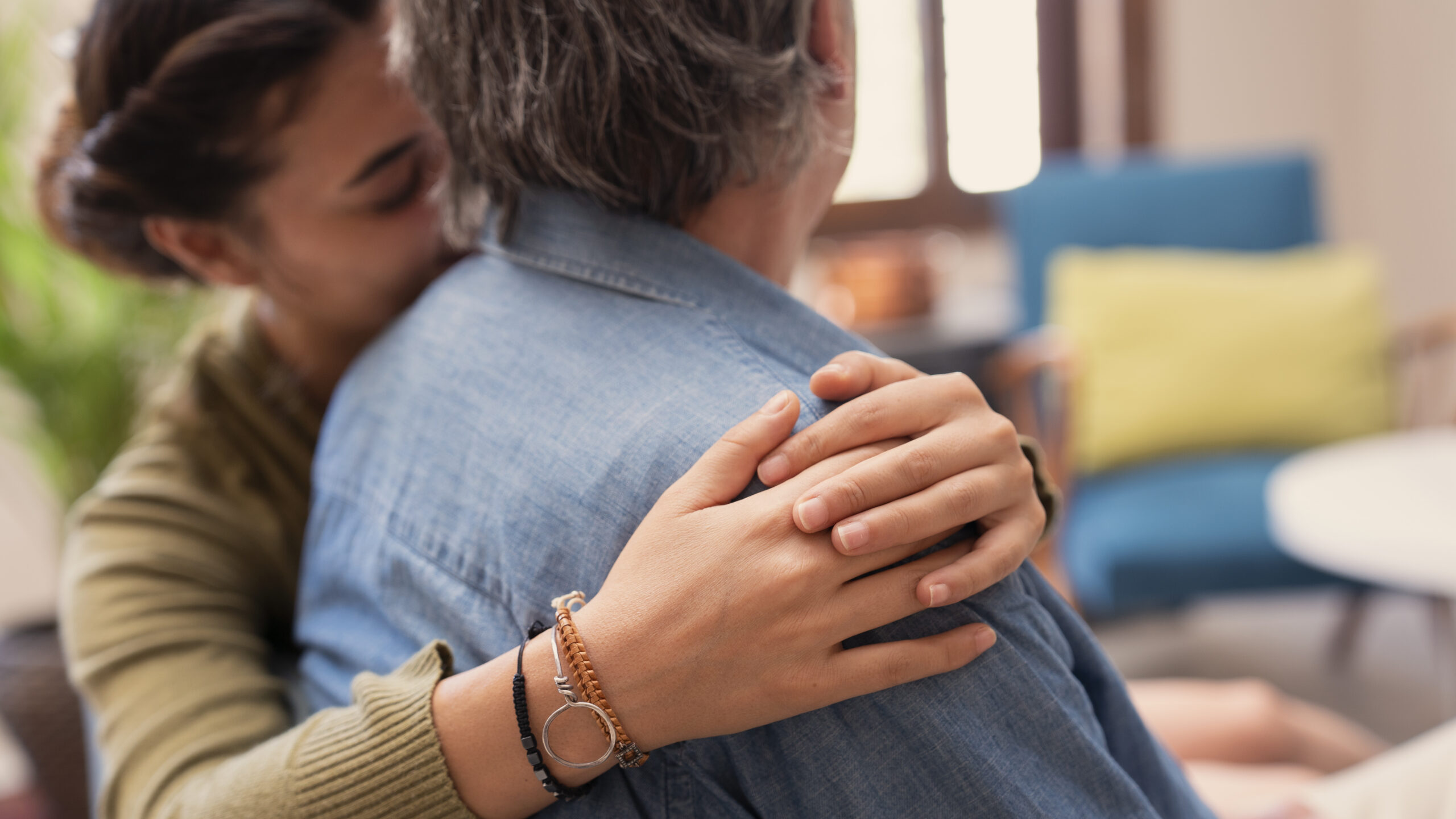 Close up photo of hands during an embrace