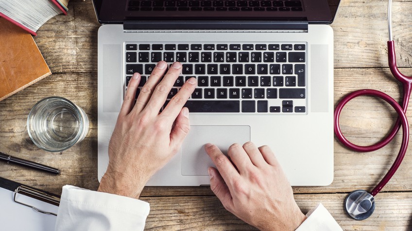 doctor using laptop computer.