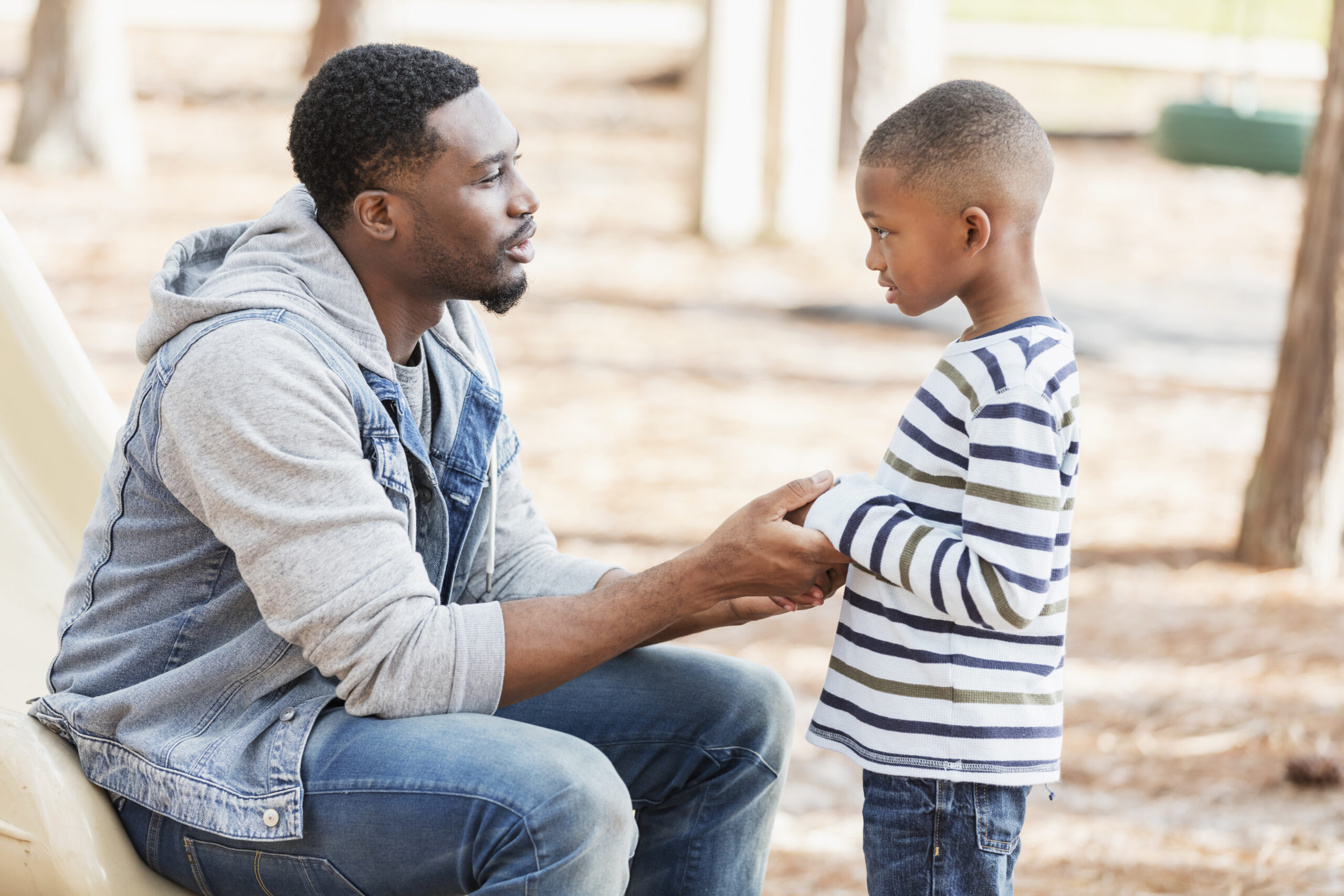 Dad talking with young son