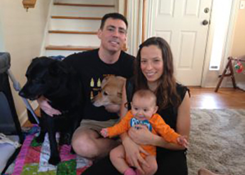 Family picture of Allison, Daniel, Clover Harrold, and their two dogs