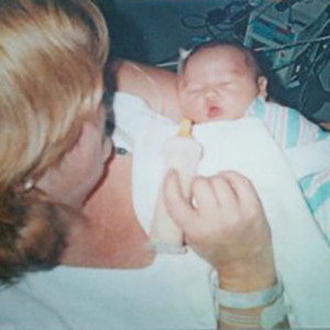 Mary Ellen holding her newborn son, James