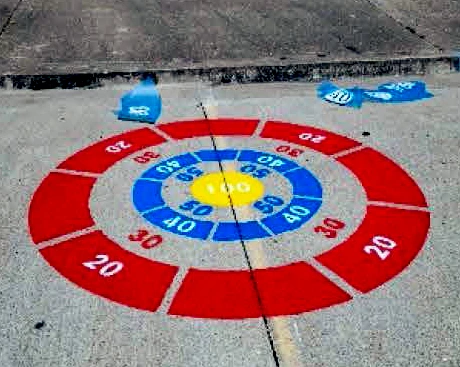 painted_play_space Colorful bullseye target game painted on the sidewalk.