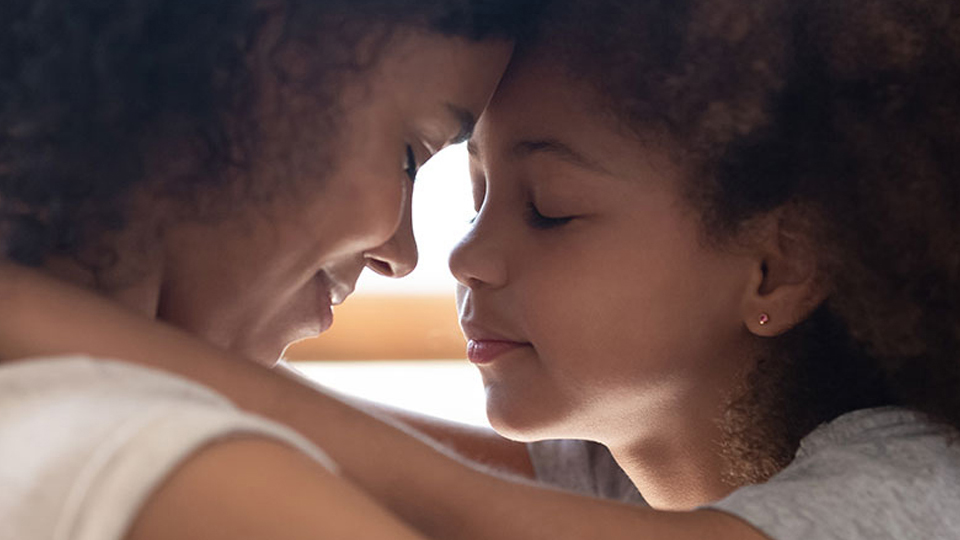 care for each other Young black mother in an embrace with her daughter.