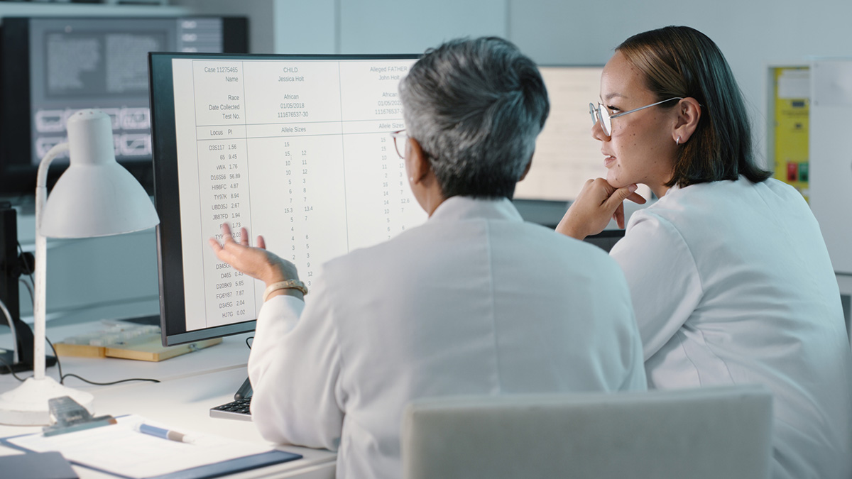 Doctors review patient information on a computer Doctors review patient information on a computer.