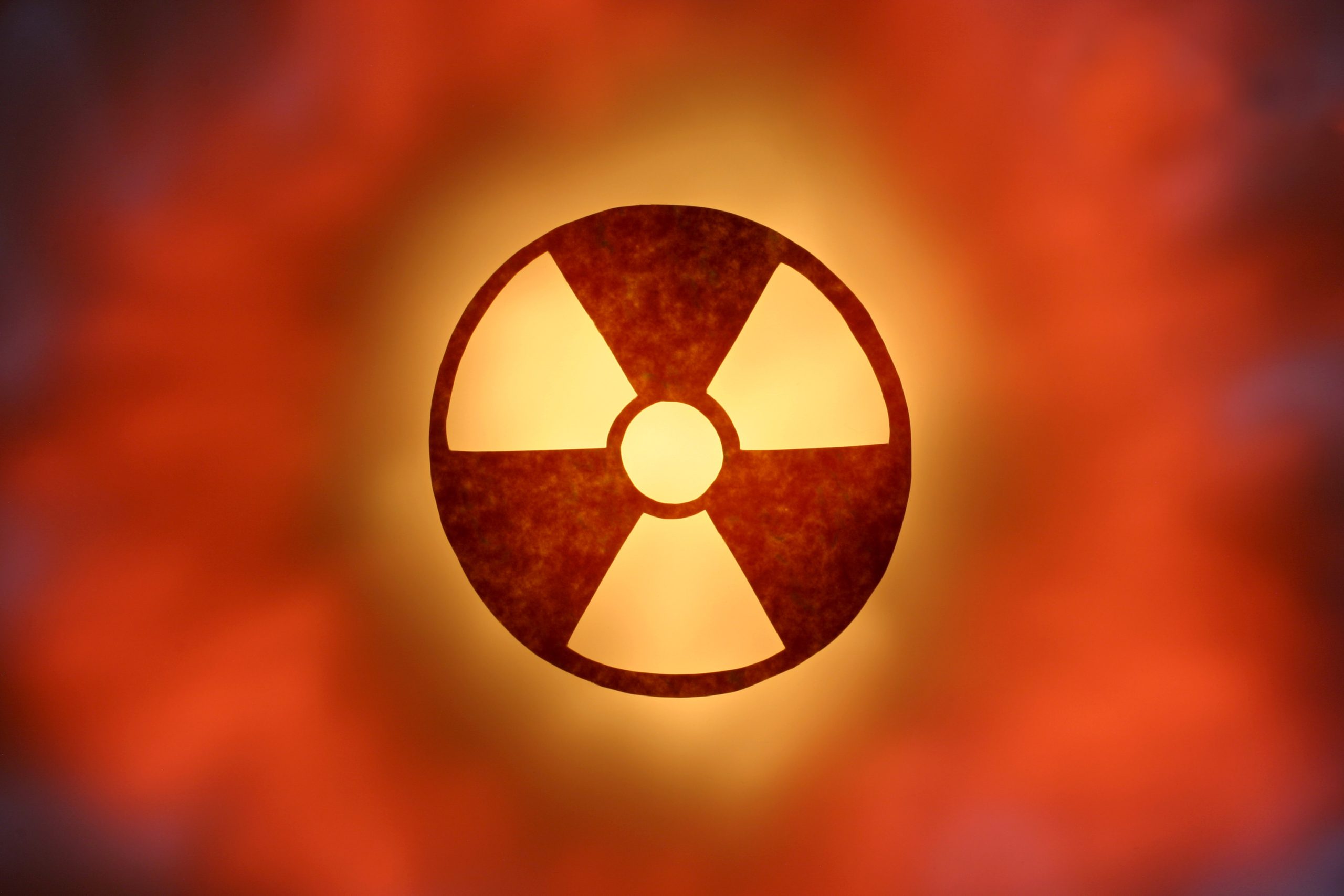 Glowing Radioactive Symbol image 209 KB Red-orange colored glowing radioactive symbol