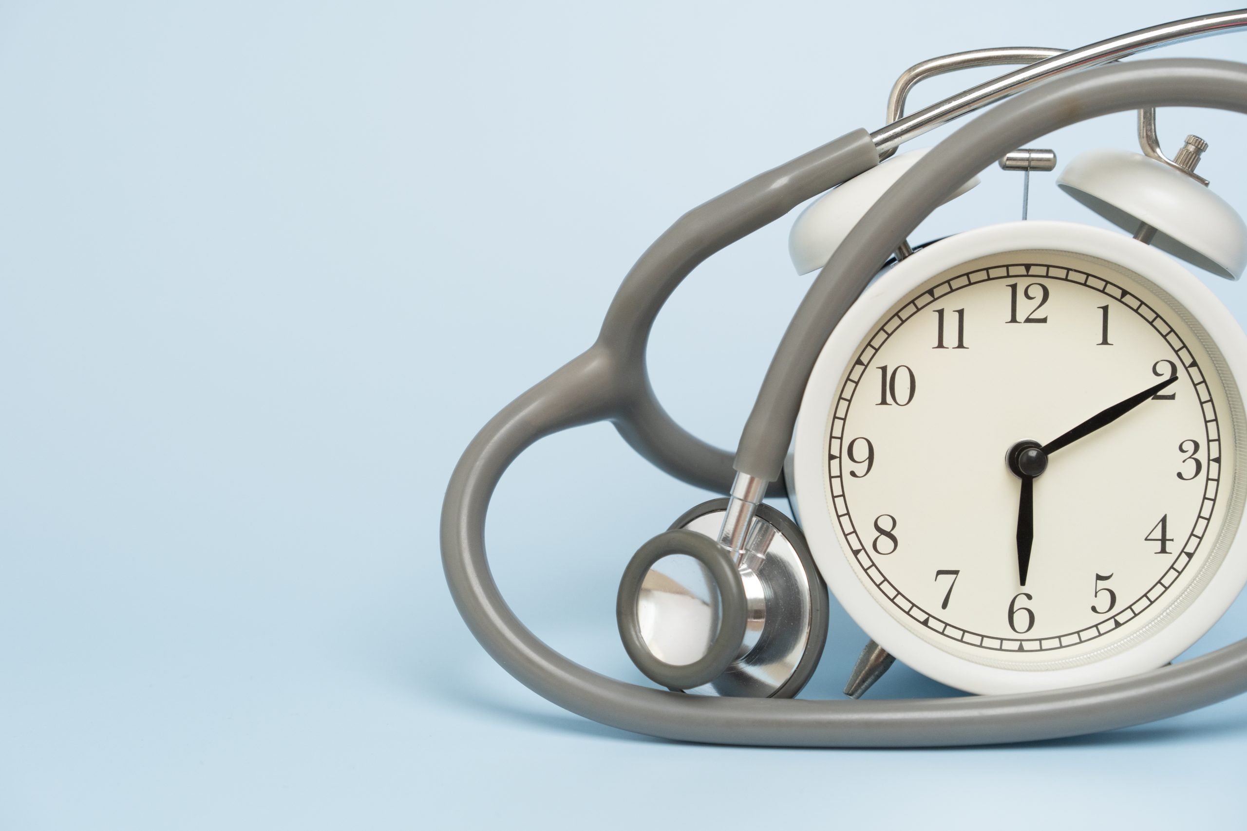 Stethoscope and Alarm Clock image 234 KB Close-up of a grey stethoscope draped over an analog alarm clock