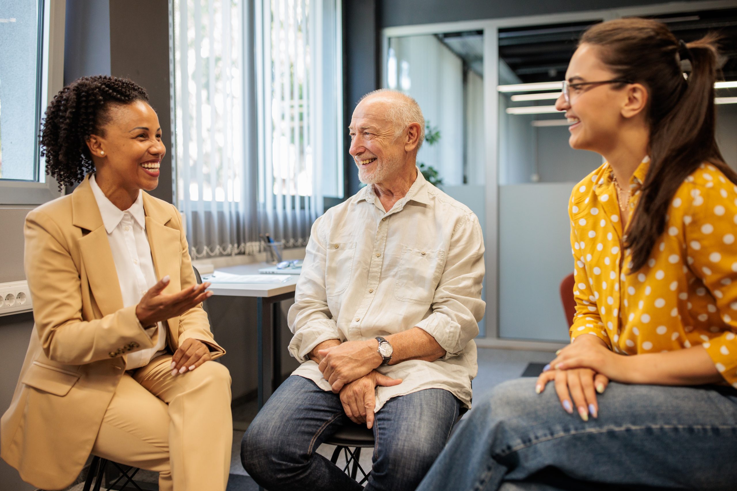 Three people meeting in an office space