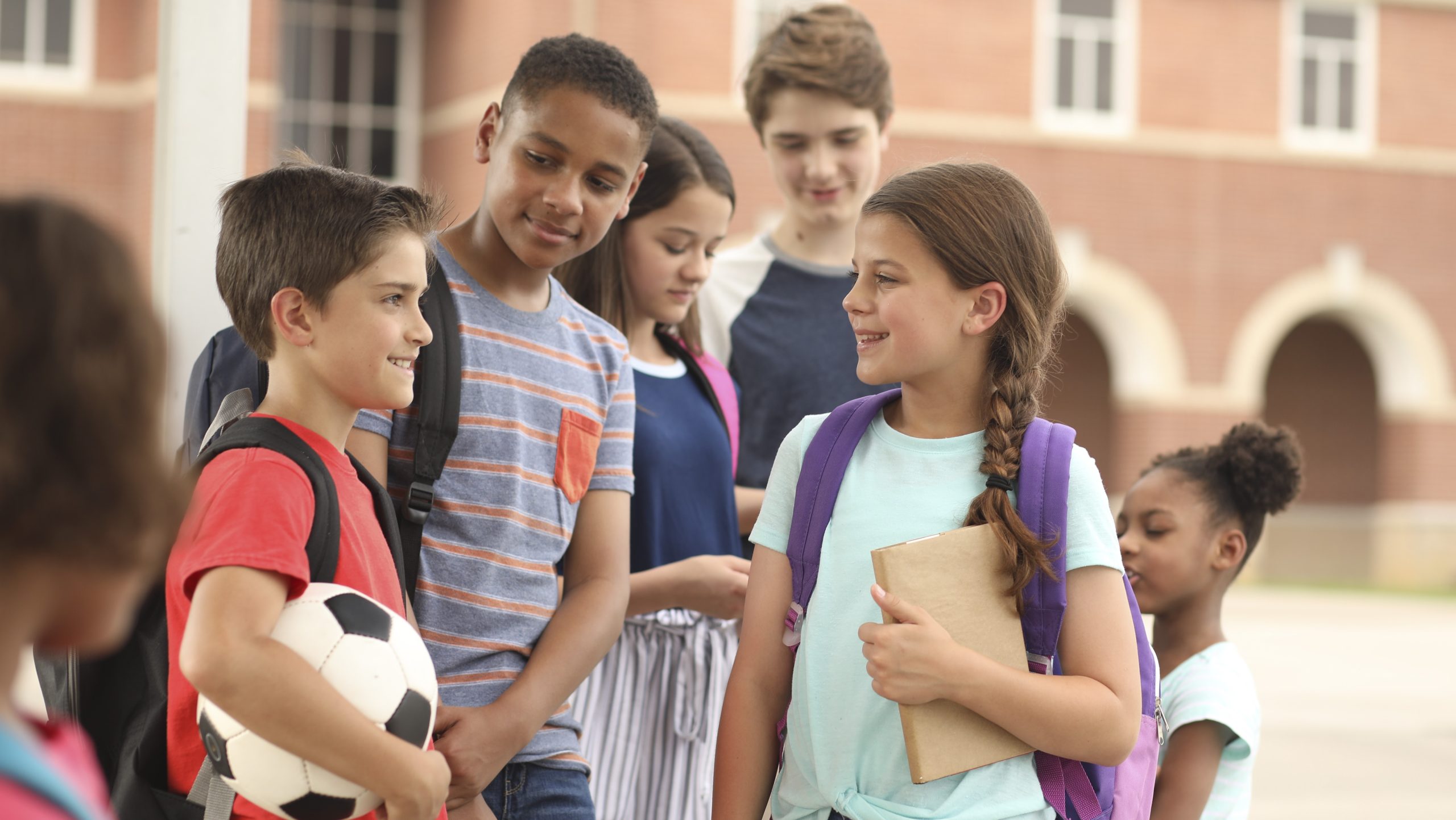 Middle school students outside Middle school students socialize outside.
