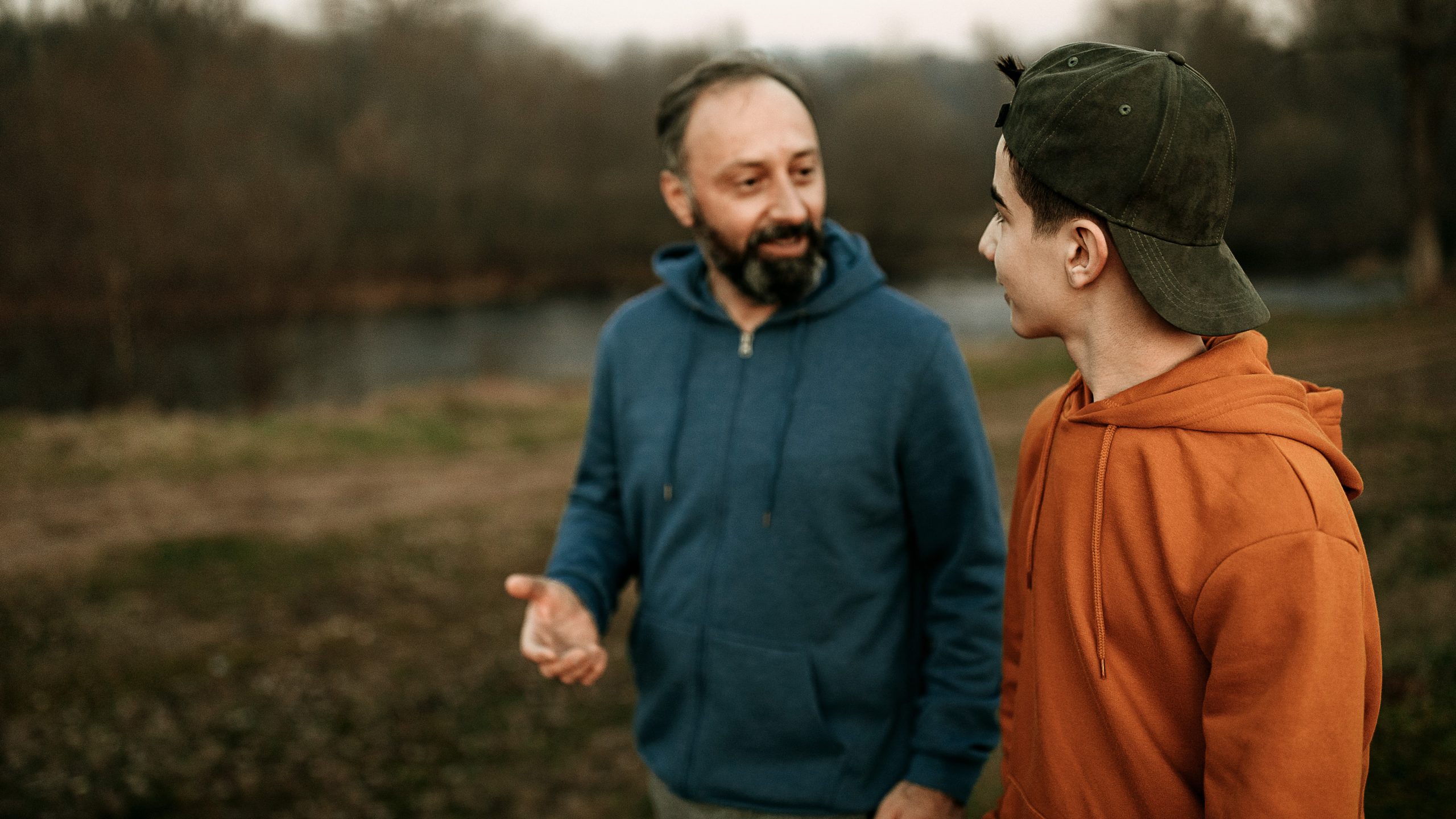 Parent and teen talking Father and teen talk about e-cigarettes