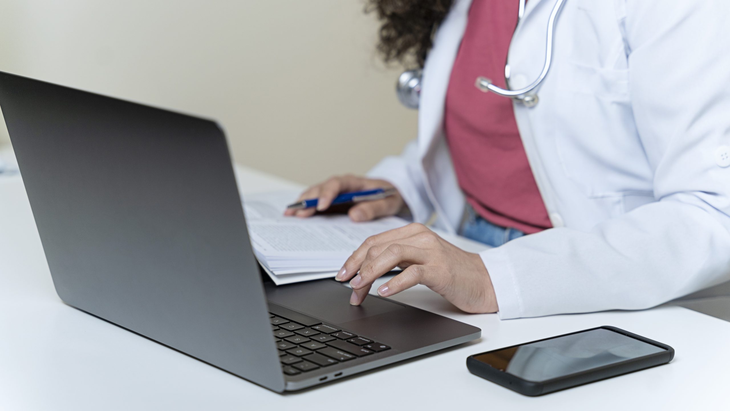 Female doctor using a laptop computer.
