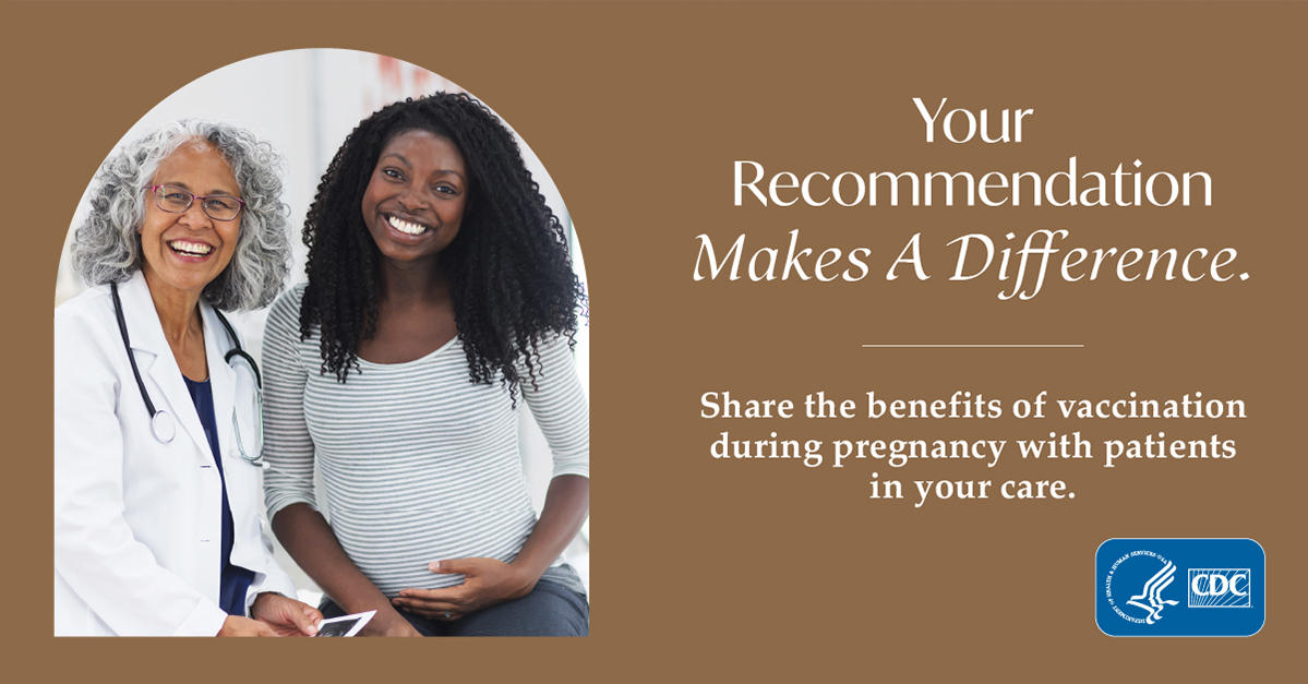 A healthcare provider talking to a pregnant woman.