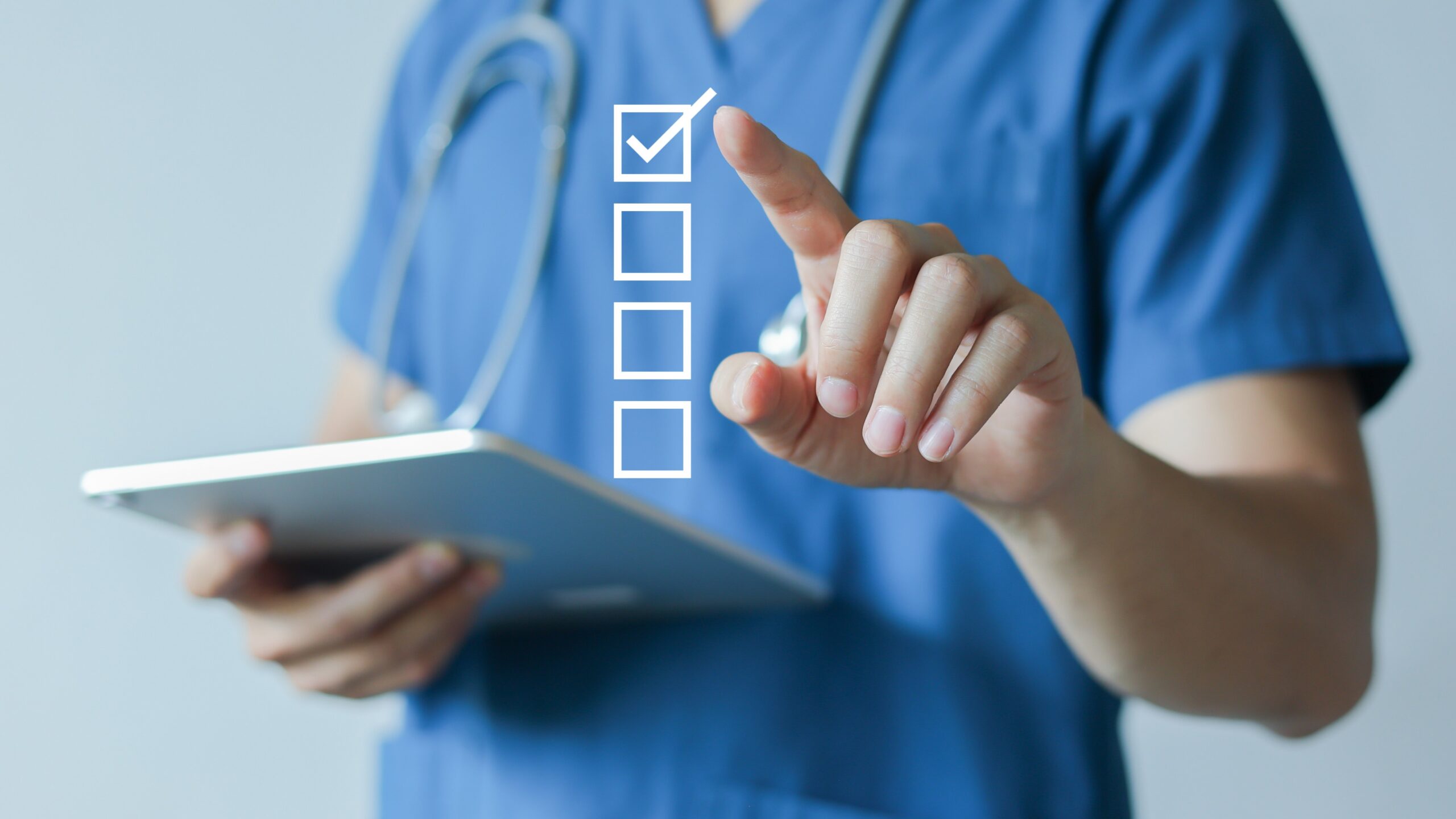 Image of health care professional checking a virtual box with finger